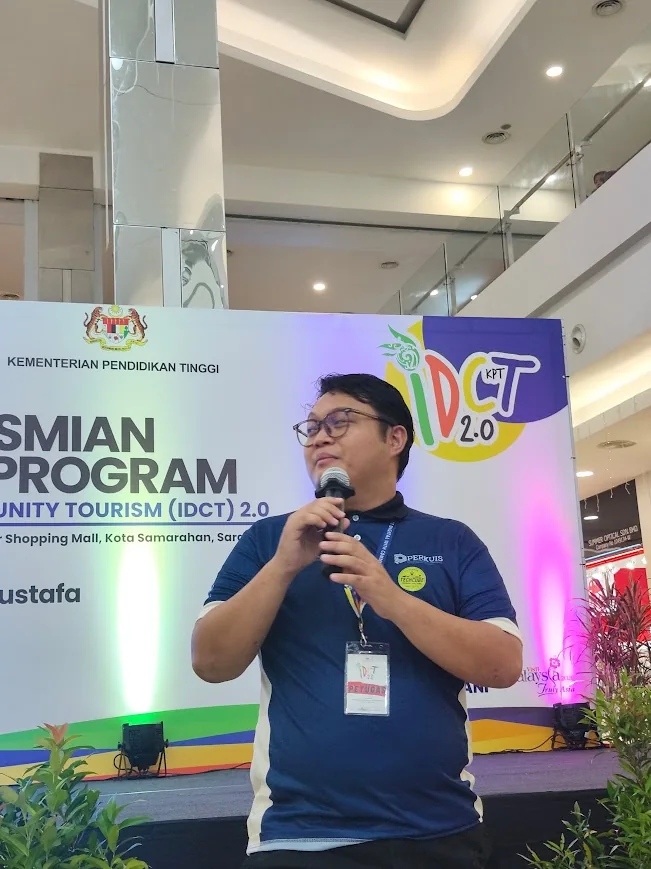 Coach BMR speaking at a community youth event