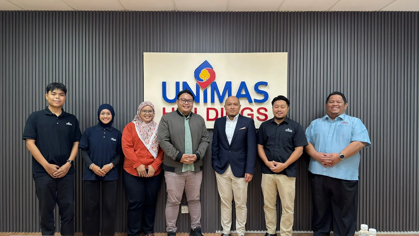 Coach BMR in a group photo at UNIMAS